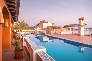 Swimming Pool Prints: Beautiful hotel terrace in Cala Fornells at sunrise, Mallorca, Balearic Islands, Spain