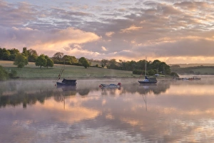Beautiful sunrise above a tranquil Wimbleball Reservoir in Exmoor National Park, Somerset Beautiful sunrise above a tranquil Wimbleball Reservoir in Exmoor National Park, Somerset