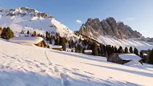 Odle Prints: a beautiful sunset on the Geisler in Villn√∂ssertal with a group of mountain huts in the foreground