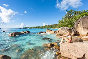 Praslin Prints: A beautiful woman relaxing on the beach. Anse Lazio, Praslin, Seychelles, Africa (MR)