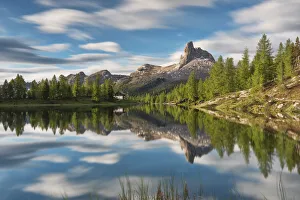Larix Prints: Becco di Mezzodi mountain is reflected in Federa lake, Dolomites