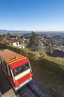 Upper Town Prints: Bergamo, Lombardy, Italy. Cable car with Upper Town (Citta Alta) in the background