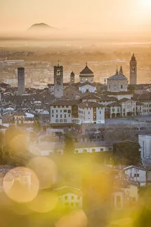 Images Dated 17th January 2017: Bergamo, Lombardy, Italy. High angle view over Upper Town (CittAA┬á Alta) at sunrise