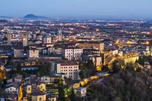 Upper Town Prints: Bergamo, Lombardy, Italy. High angle view over Upper Town (Citta Alta) at dusk