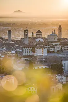 Upper Town Prints: Bergamo, Lombardy, Italy. High angle view over Upper Town (Citta Alta) at sunrise