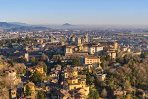 Upper Town Prints: Bergamo, Lombardy, Italy. High angle view over Upper Town (Citta Alta) at sunset
