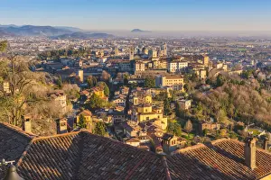 Upper Town Prints: Bergamo, Lombardy, Italy. High angle view over Upper Town (Citta Alta) at sunset