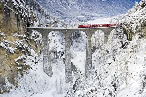 Viaduct Prints: Bernina Express train on Landwasser viaduct in winter, Filisur, canton of Graubunden