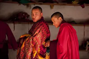 Bhutan. Participants at the tsechu in Wangdue Phodrang getting ready for a performance