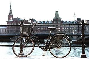 Bicycle near the river in Stockholm, winter day, snow. Sweden, Europe
