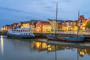 Nordfrisland Prints: Binnenhafen port with anchored boats and colorful houses at twilight