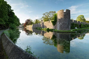 Images Dated 20th September 2023: The Bishop's Palace reflected in its moat, Wells, Somerset, England. Spring (May) 2019