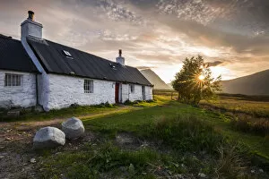 Black Rock Cottage at sunset, Ballachulish, Glencoe, Highlands, Scotland, United Kingdom
