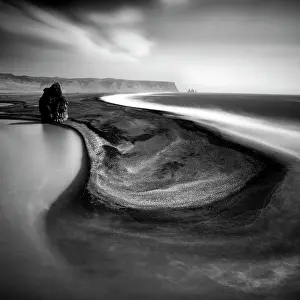 Vik Y Myrdal Prints: The black sand beach of Reynifjara with the Reynisdrangar rock stacks in the distance