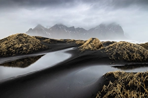 Black Prints: Black sand dunes in front of Vestrahorn mountain