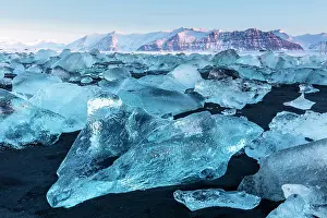 Icelandic Prints: Black volcanic sand beach covered in icebergs from Jokulsarlon glacier lagoon
