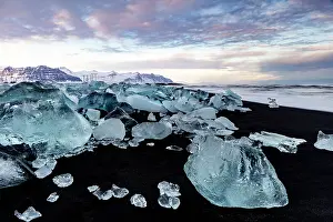 Southeast Iceland Prints: Black volcanic sand beach covered in icebergs from Jokulsarlon glacier lagoon