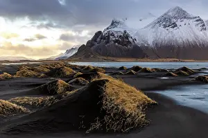 Icelandic Prints: Black volcanic sand dunes covered in grass with Vestrahorn in the distance