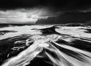 Wind Prints: A black and white perspective of the rugged Okshornan peaks seen from Tungeneset on a stormy evening