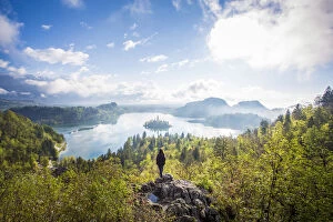 Images Dated 26th June 2017: Bled Lake, Slovenia. Sunrise over the misty island from a high viewpoint with hiker
