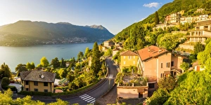 Blevio, lake Como, Como province, Lombardy, Italy. The winding coastal road at sunset