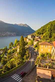 Winding Road Prints: Blevio, lake Como, Como province, Lombardy, Italy. The winding coastal road at sunset