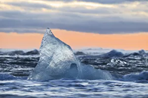 Artic Prints: a block of ice at Diamond Beach taken during a winter sunset
