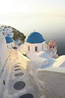 Aegean Prints: Blue domed churches, white-washed houses and steps with caldera view in the distance
