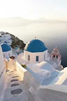 Aegean Prints: Blue domed churches, white-washed houses and steps with caldera view in the distance