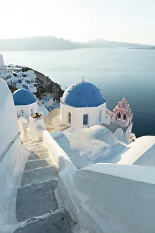 Blue Domed Prints: Blue domed churches, white-washed houses and steps with caldera view in the distance