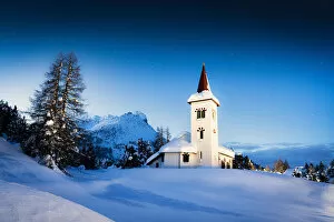 Blue hour at Chiesa Bianca surrounded by snow, Maloja, Bregaglia Valley