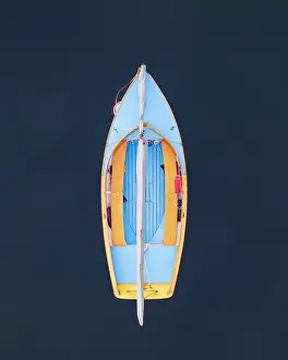 Falmouth Prints: A blue sailboat at rest on Cape Cod