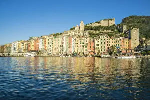 The blue sea frames the typical colored houses of Portovenere La Spezia province Liguria