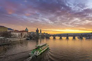 Prag Prints: Boat going towards Charles Bridge and Church of Saint Francis of Assisi with Old Town