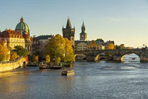 Images Dated 25th February 2022: Boat going towards Charles Bridge and Old Town Bridge Tower, Prague, Bohemia, Czech Republic