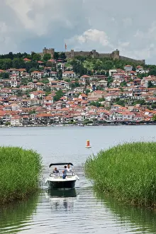 Macedonia Prints: Boat on Lake Ohrid with Ohrid Castle beyond, Ohrid, North Macedonia