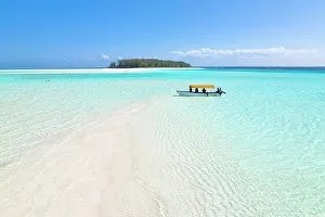 February Gallery: a boat is moored near an atoll during a magnificent sunny day, Zanzibar, Tanzania