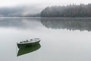 Boat on Sylvenstein Lake in the morning. Bad TAA┬Âlz-Wolfratshausen district, Bavaria