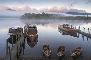 Boats on Derwent Water on a misty autumn morning, Lake District National Park, Keswick