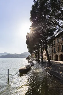 Ceresio Prints: Boats on the lakefront of the small town of Morcote during a spring day, Canton Ticino