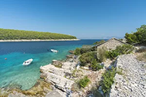 Boats at the little pier of Tankaraca cove in summer
