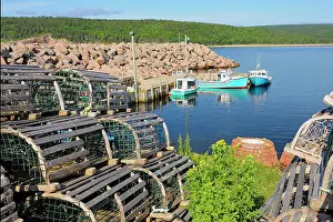 Lobster Traps Prints: Boats and lobster traps in coastal village Neils Harbour Nova Scotia, Canada