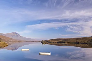 Loch Fada Prints: Boats on a mirror still Loch Fada, Isle of Skye, Scotland, UK. Autumn (November) 2015