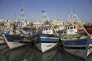 Boats moored in the busy fishing port in Tangier, Morocco