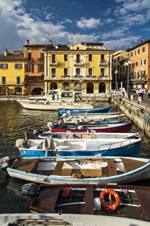Boats moored in the harbor of Malcesine, Lake Garda, Veneto, Italy