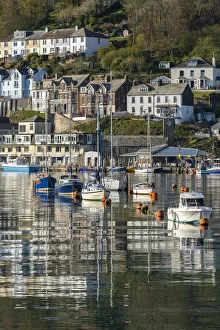 Boats moored in Looes pretty harbour at dawn, Looe, Cornwall, England