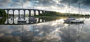 Images Dated 5th July 2022: Boats moored on the River Tiddy at dawn below the Victorian viaduct at St Germans, Cornwall