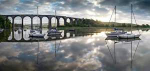 Images Dated 5th July 2022: Boats moored on the River Tiddy at dawn below the Victorian viaduct at St Germans, Cornwall