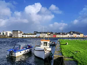 Images Dated 31st March 2023: Boats at the Nimmo's Pier and The Long Walk in the background, Claddagh Quay, Galway