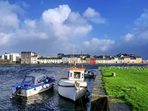 Images Dated 31st March 2023: Boats at the Nimmo's Pier and The Long Walk in the background, Claddagh Quay, Galway